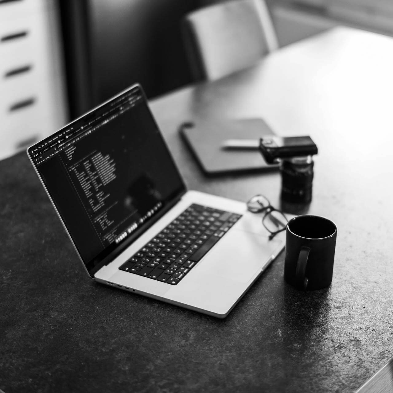 <br />
Monochrome Photo of Coffee beside a Laptop